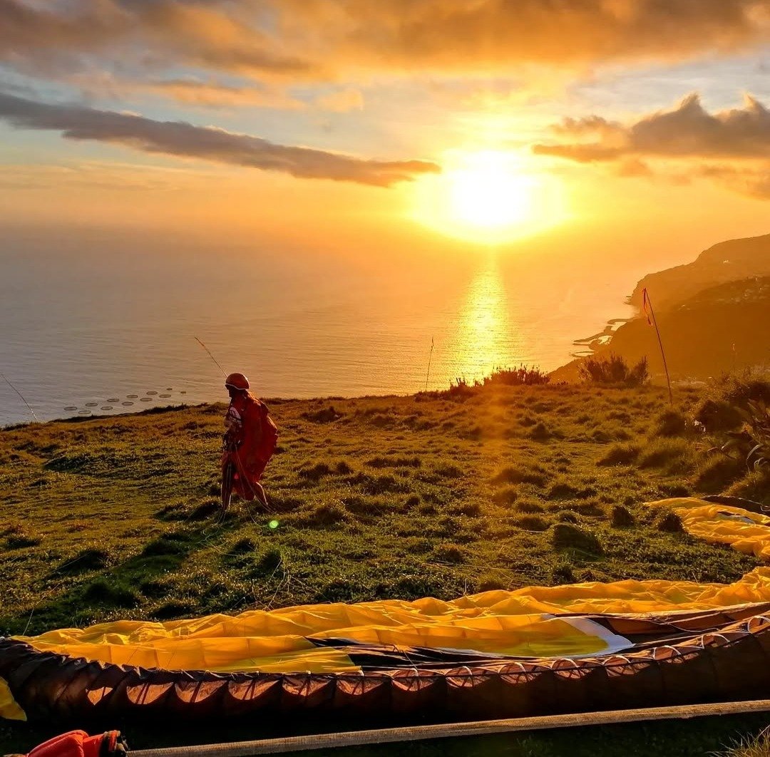 sun set image of romantic paragliding