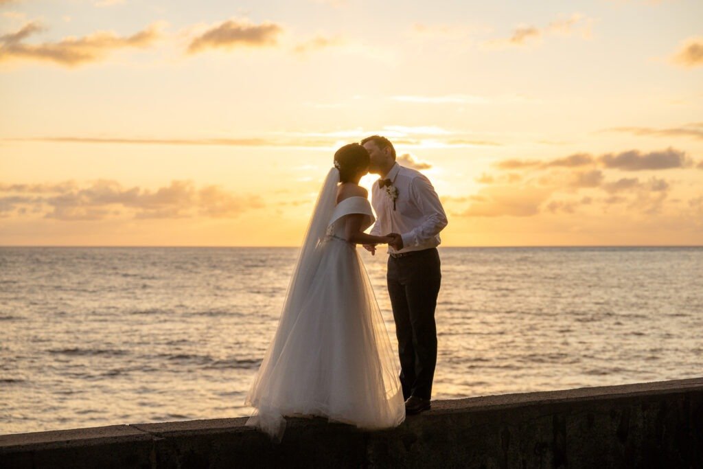 Newly weds kissing in a sunset photoshoot in Madeira Island