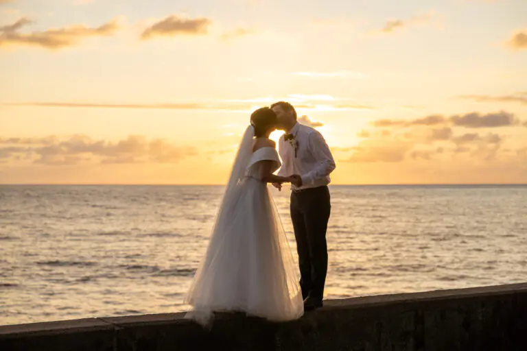 Newly weds kissing in a sunset photoshoot in Madeira Island